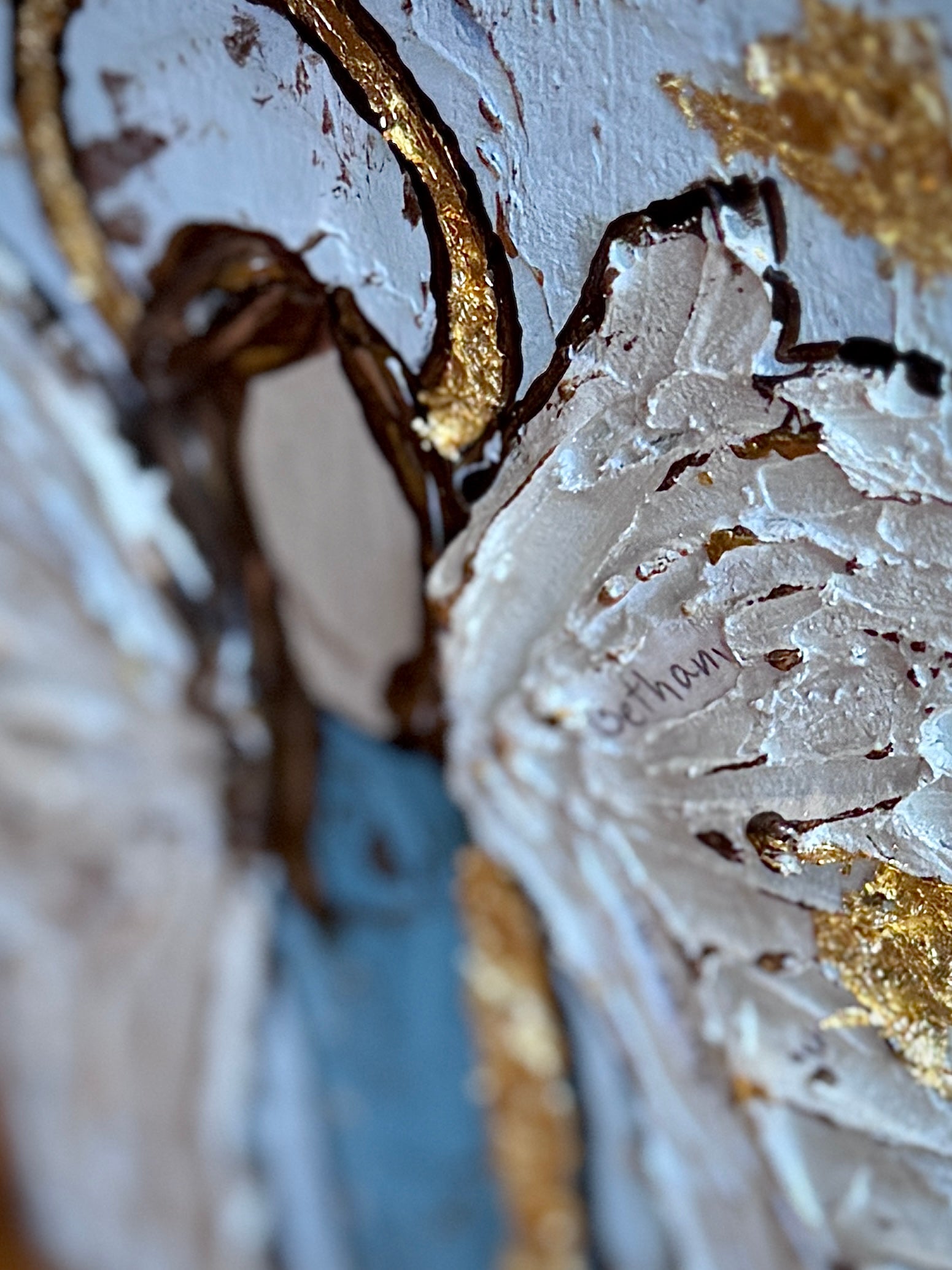 Close-up of a decorative item with gold and white patterns

